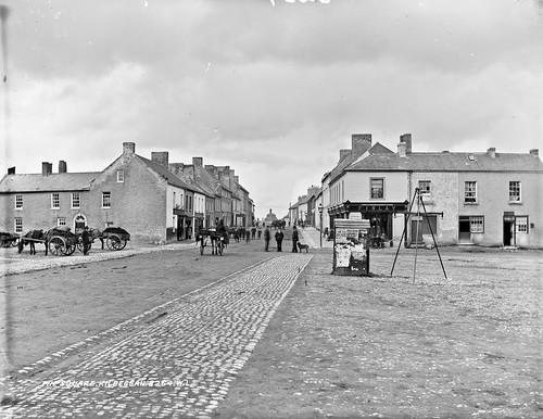 robertfrench williamlawrence lawrencecollection lawrencephotographicstudio glassnegative nationallibraryofireland westmeath thesquare kilbeggan leinster dog posters horseandcart turf scales shops finlay moran johnkelly may1905 1905 1stmay1905 scrofuloustatterdemallions naggin lawrencephotographcollection