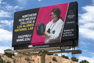 A billboard in Pojoaque along Highway 502 promotes the collaborative program between Northern New Mexico College and the Laboratory.