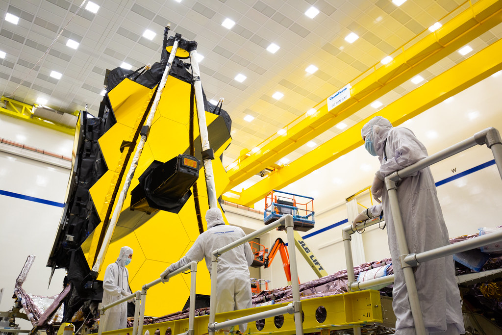Engineers examine the James Webb Space Telescope before launch.