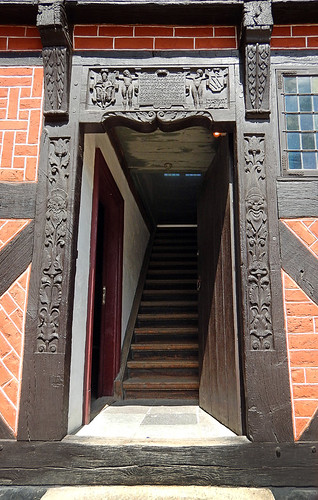 Old carved wood door in the 1864 village of the large open-air museum in Aarhus, Denmark