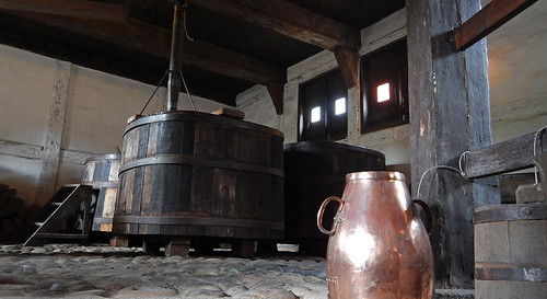 Copper pot and wooden vats in an old brewery in the 1864 village of the large open-air museum in Aarhus, Denmark