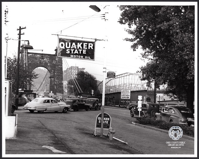 Cars turning onto the Suspension Bridge at the Intersection of S. Front and Virginia Streets, 1949