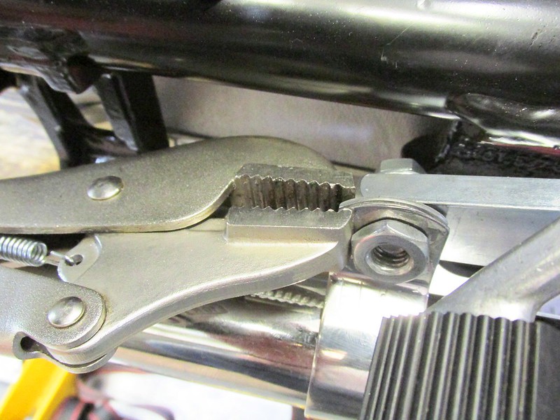 Compress Header Bracket To Install Brown's Side Stand Bolt & Special Nut