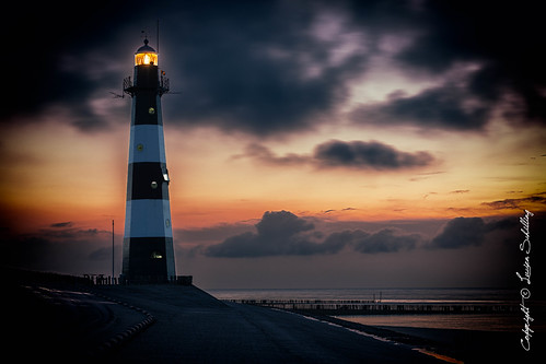 breskens zeeland netherlands lighthouse sunset clouds beach sea summer water
