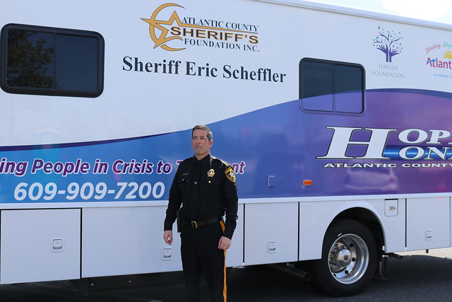 A sheriff in front of the Hope One Mobile Unit