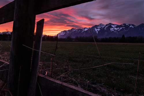 sunset red clouds mountains landscape horizon fence