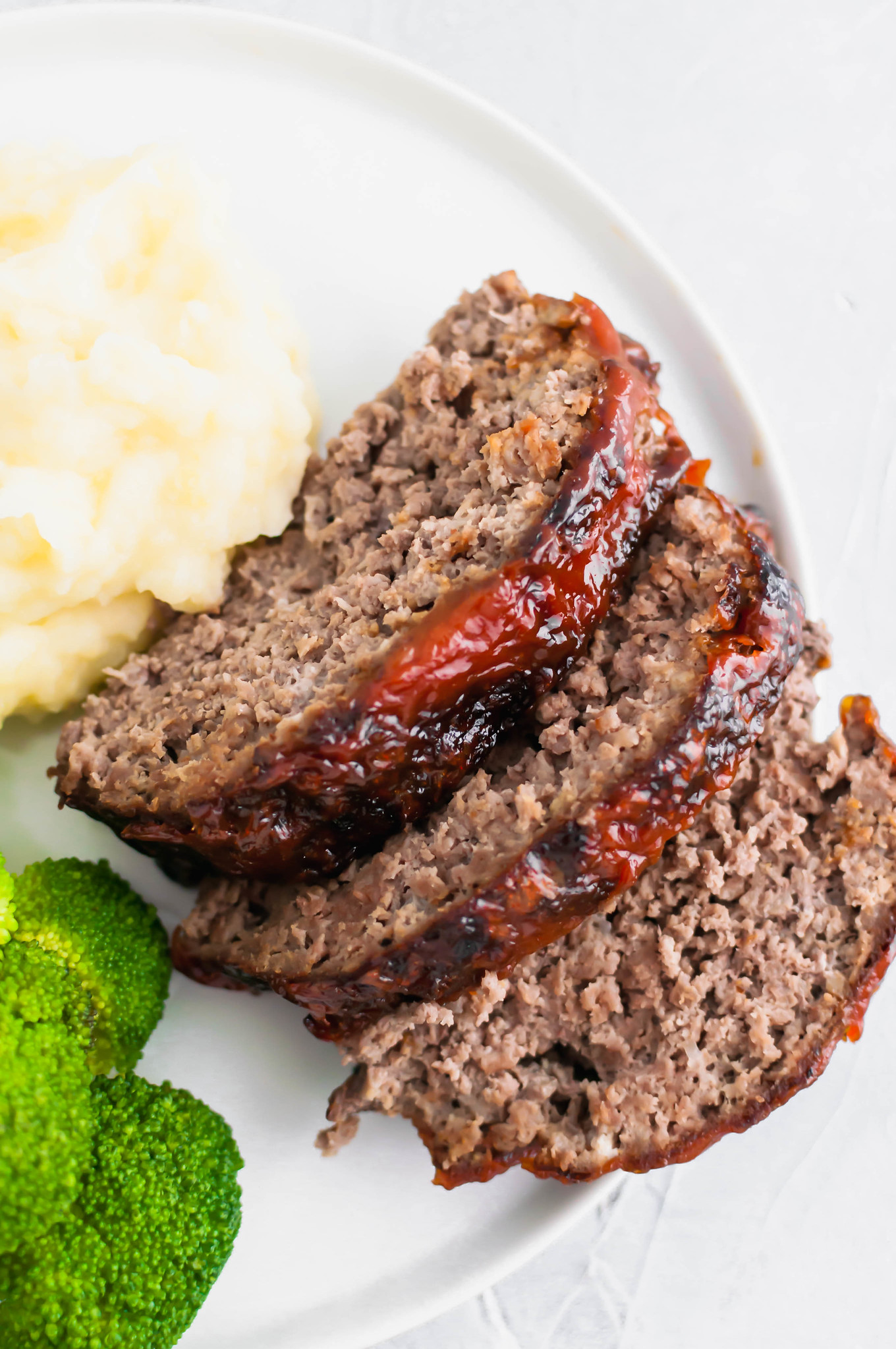 Crispy on the outside and juicy on the inside, this Air Fryer Meatloaf is simple and quick enough for a weeknight meal. Slathered with a delicious glaze to put it over the top.