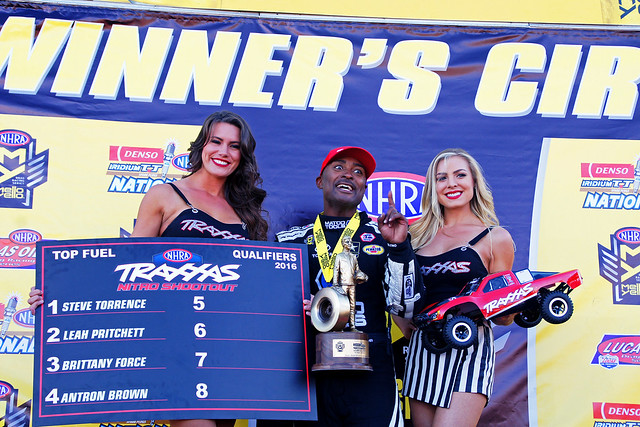 NHRA top fuel driver Antron Brown with championship trophy at the Las Vegas Motor Speedway
