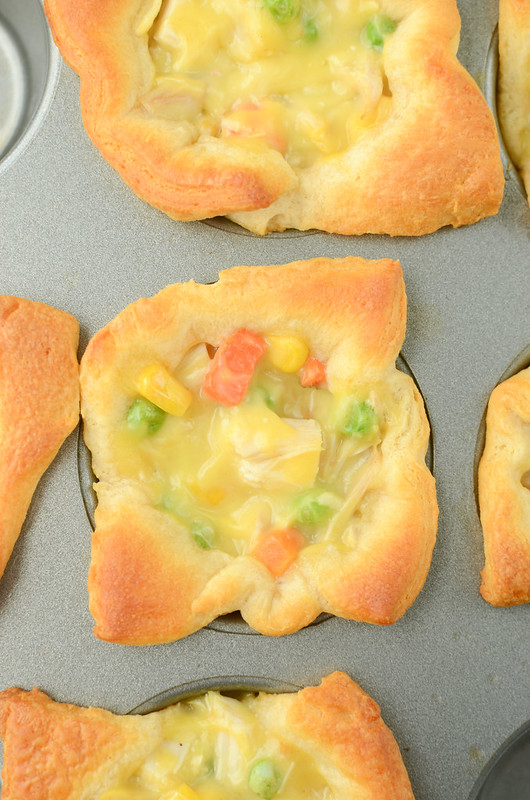 Chicken Pot Pie Cups - only 4 ingredients and ready in 30 minutes! Crescent roll cups filled with chicken pot pie filling and baked until golden brown and delicious. 