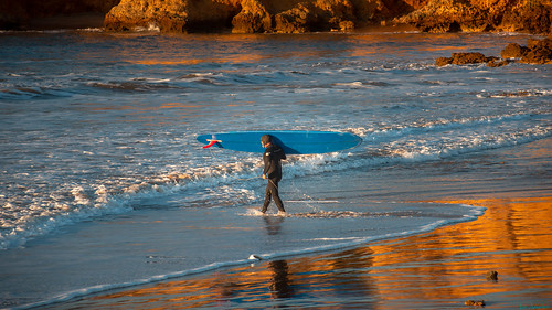nikond810 nikkor 200mm goldenlight golden beach torquaybeach reflection rocks surfer winter victoria australia seascape landscapephotography southernocean water sport ripcurl long board