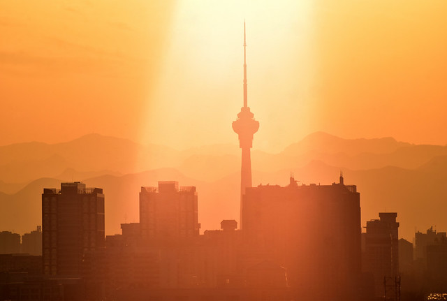 Orange Beijing city skyline in the spotlight, China