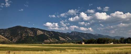 wyoming blue white clouds vacation wilderness golf ranch beautiful wife nakedbeauty mountains rugged alpine green fields grazing covid free