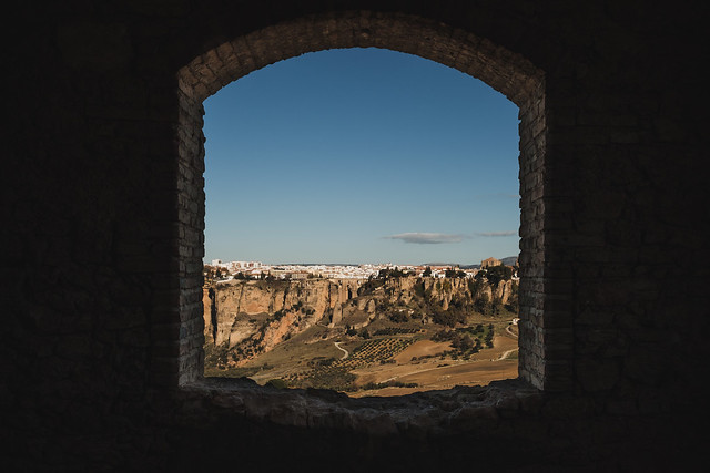 Looking on to Ronda through the window of abandoned tower, Andalusia, Spain