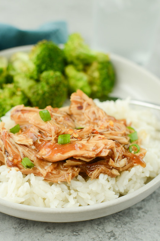 Slow Cooker Teriyaki Chicken is your new favorite takeout fakeout! Chicken breasts cooked in a sweet and slightly spicy sauce and served over rice!