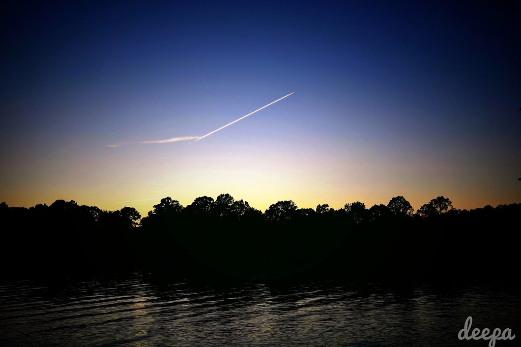 Sunset with jet contrail