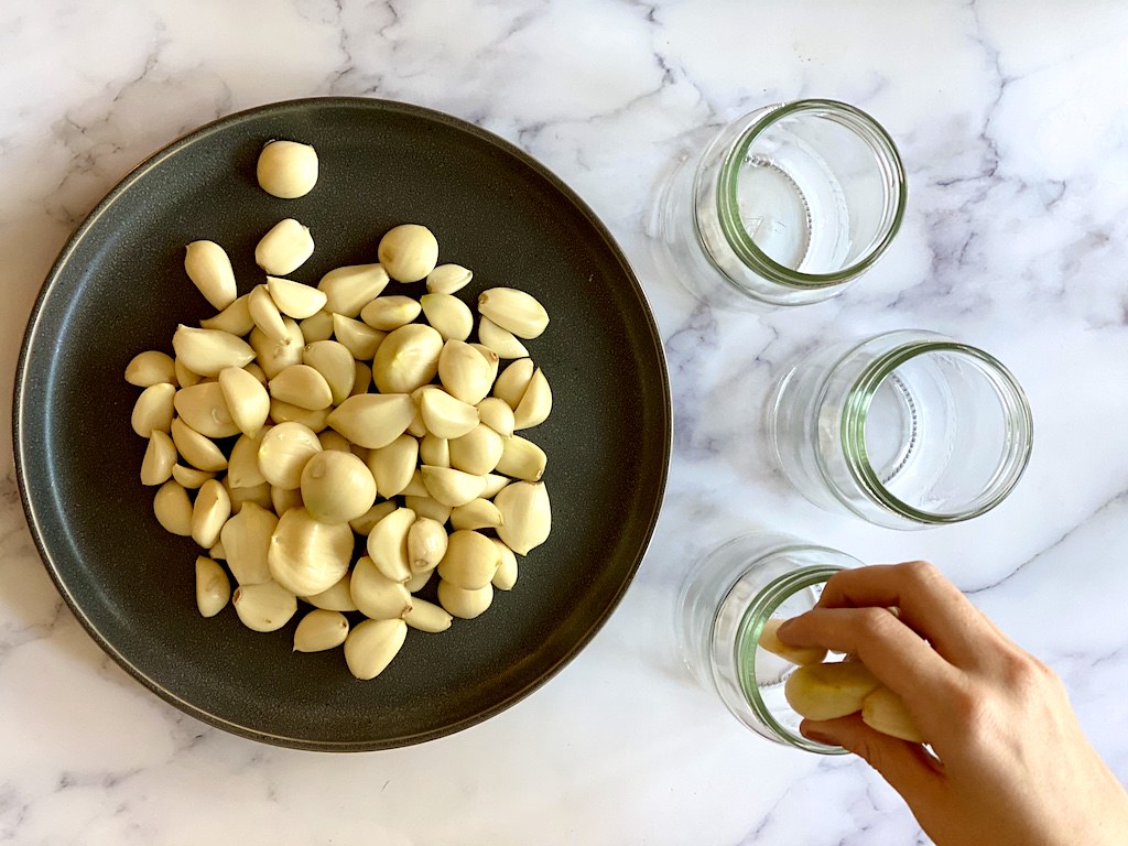 Put the garlic into your sanitized mason jars. 