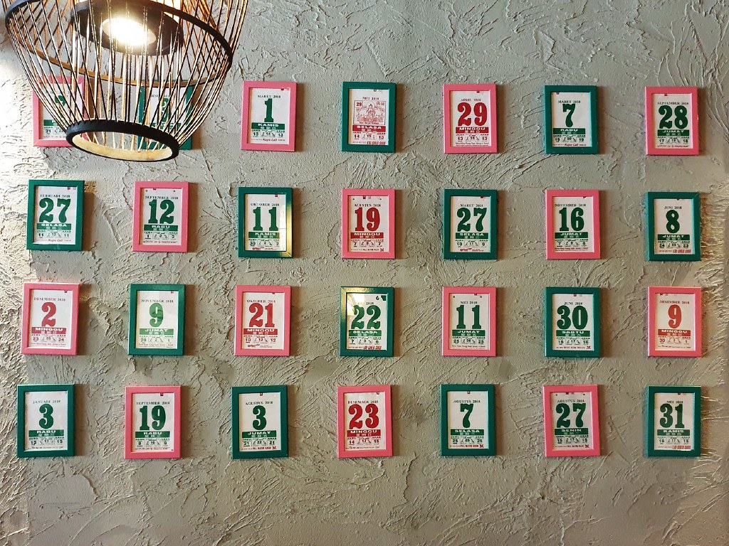 Feature wall made up of tear calendar in Kota88