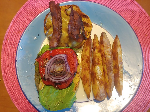 Burger with colby cheese, grilled red pepper, red onion, romaine lettuce and center cut bacon on a toasted brioche bun. Served with oven baked potatoe spears seasoned with paprika and salt.