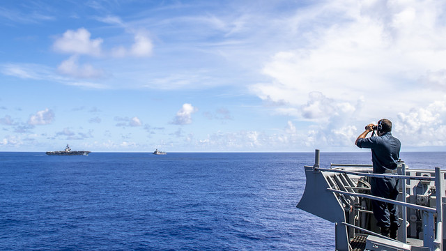 A Sailor stands watch USS Comstock (LSD 45).