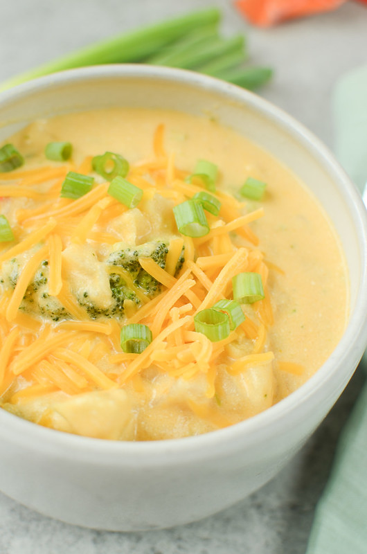 Slow Cooker Cheesy Potato Broccoli Soup - easy vegetarian soup cooked in the crockpot. It starts with frozen hash browns and frozen broccoli so there's almost no prep involved! A kid favorite during fall and winter!