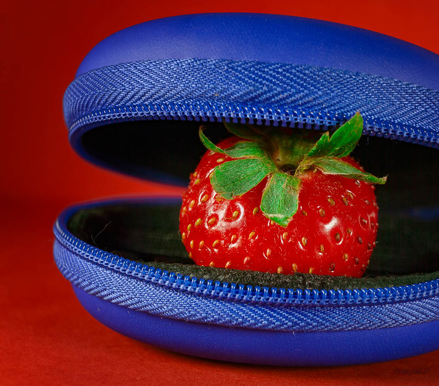 Electric blue pouch and red strawberry
