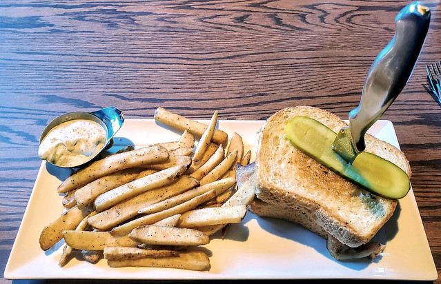 Grilled cheese burger, with dill pickle slice, French fries and dill dipping sauce