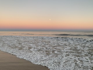 Waxing Gibbous Moon Full Corn Moon Aquarius sign moonlight over the Atlantic Ocean Fire Island National Seashore FINS beach NY USA August 2020