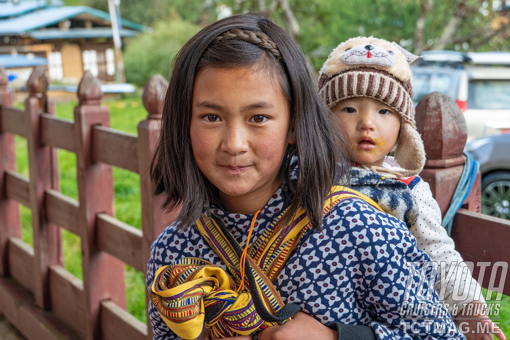 Young girl carrying her little brother in Tang Valley