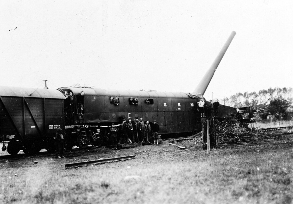 One of the five 14-inch guns sent by the Navy for service in WWI fires at a target from Thierville, France, in early fall 1918. Note the ammunition car attached to the gun car.