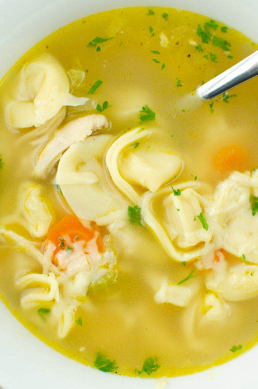 Chicken Tortellini Soup - classic chicken noodle soup made with cheese tortellini and topped with Parmesan cheese! The perfect comfort food for a chilly day or when you're feeling under the weather. 