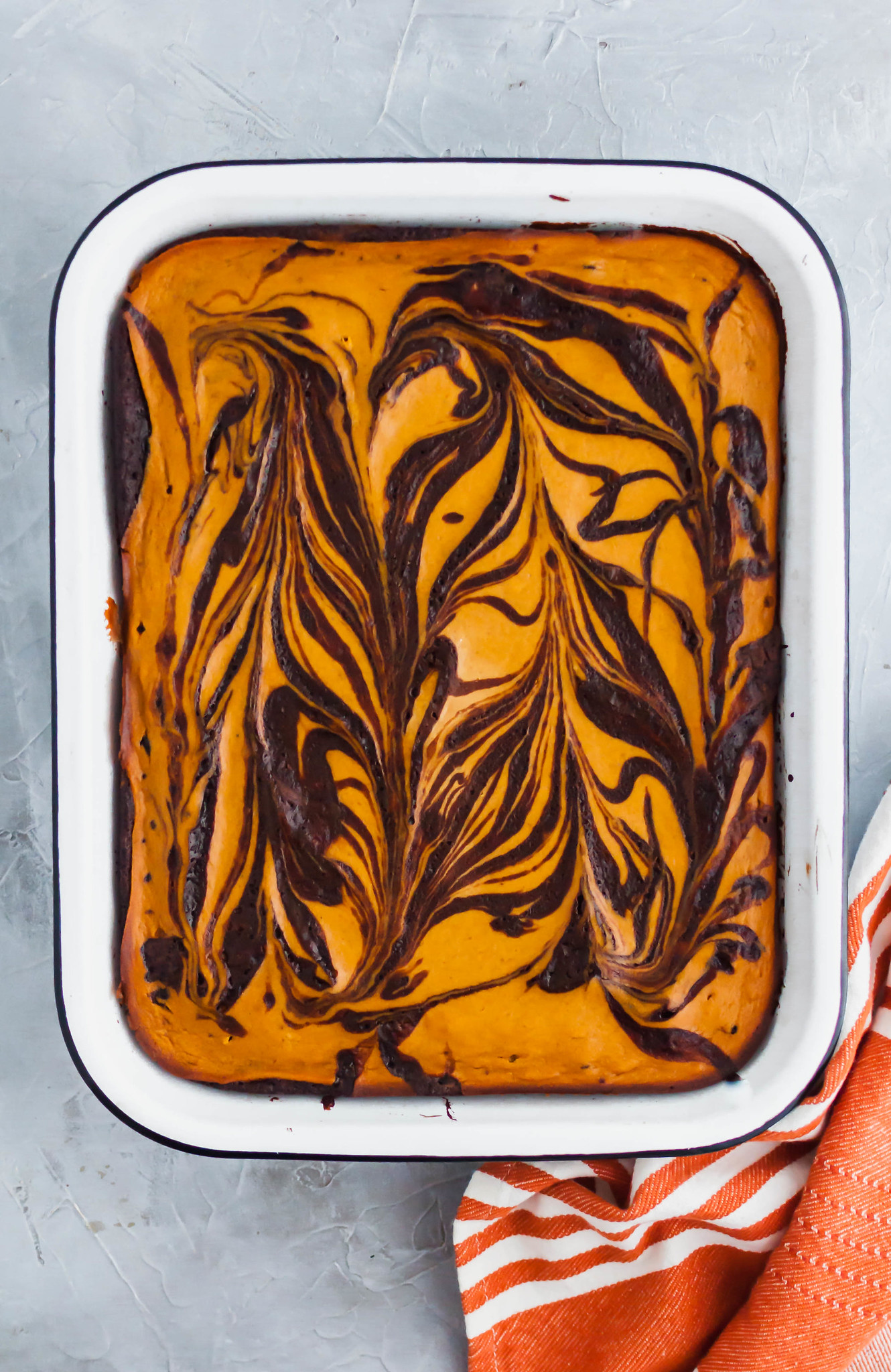 These Pumpkin Cheesecake Brownies are a must try dessert this fall. Thick, fudgy one pot brownies topped with a simple, delicious spiced pumpkin cheesecake. Fall perfection.