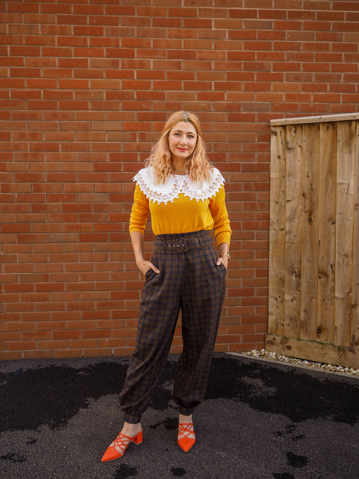 Asking the "Is This Outfit Really 'Me'?" Question: Oversized white lace collar, tangerine orange sweater, brown check balloon trousers, orange strappy mules | Not Dressed As Lamb, fashion for over 40s