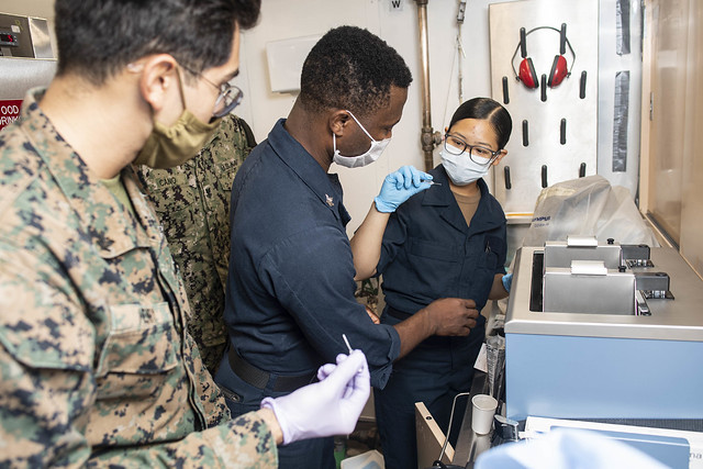 Hospitalman and Corpsman test for blood type aboard the amphibious transport dock ship USS New Orleans