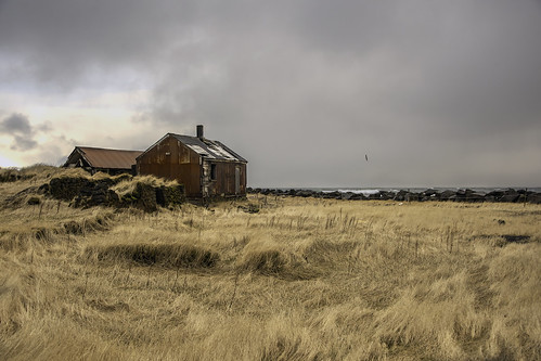 sodhouse barn farmersfield stormyday landscape stormclouds wind driedgrasses seaside hafnir reykjanespeninsula iceland