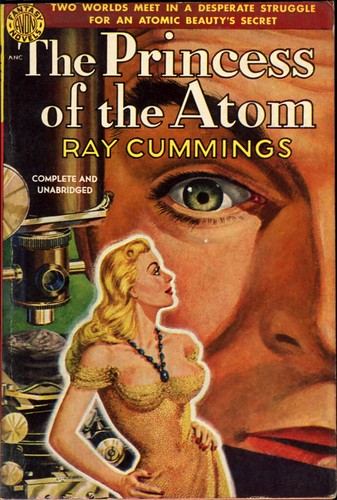 "TWO WORLDS MEET IN A DESPERATE STRUGGLE FOR AN ATOMIC BEAUTY'S SECRET"