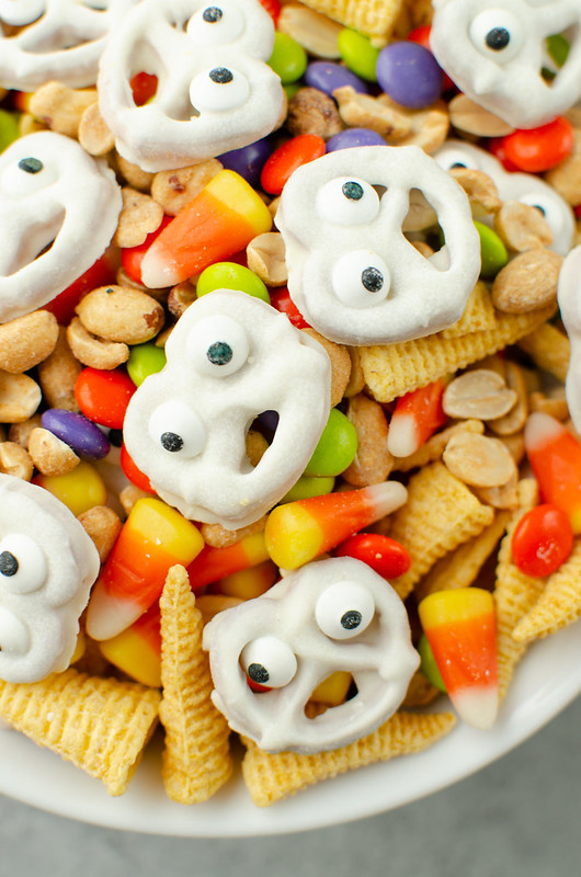 Ghostly Snack Mix - the cutest Halloween snack mix with chocolate covered ghost pretzels, Bugels, peanuts, M&Ms, and candy corn!
