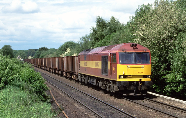 EWS Class 60, No. 60 080 'Stanley Common - EWS Rail Safety Competition Winners 2003' storms up the bank at Elsham with 6K23, the Santon to Immingham Bulk Terminal Iron ore empties.