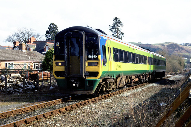 Arriva Class 158, No 158850 Slows for Caersws Station with a service from Birmingham International to Aberystwyth.