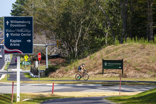 A student takes advantage of the new bike path along Monticello Avenue at the corner of Compton Drive.