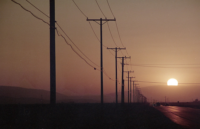 smoky sun sets on the Pearblossom Highway