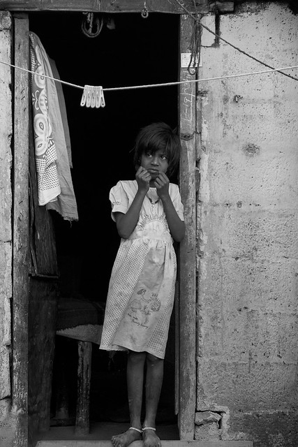 Girl in a shack doorway, Munnar, Kerala. (The Other Majority Series)