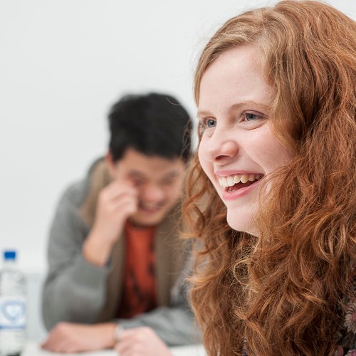 Student smiling in lecture