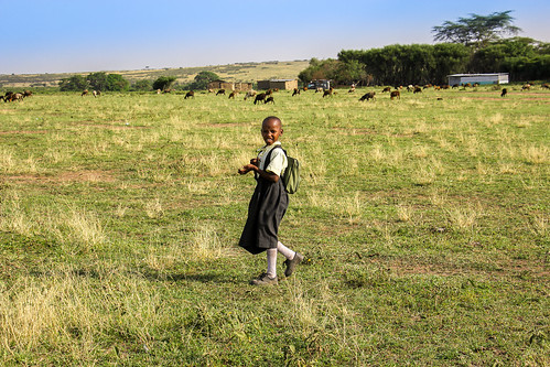 Schoolgirl in a vast green space. From Photographer Spotlight: Mathias Falcone