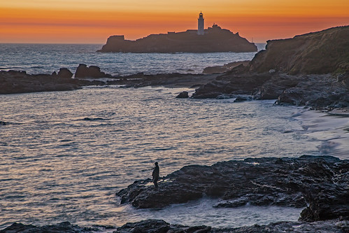 godrevy lighthouse cornwall uk andreapucci sunset fisherman