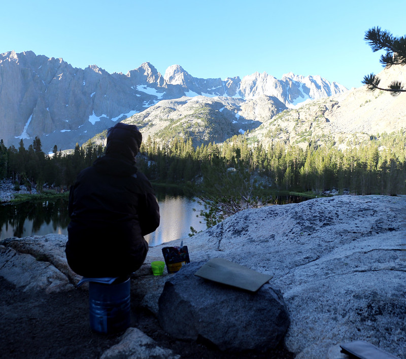 Eating breakfast in the early morning as the light hits our day's destination - Sam Mack Meadow is across the valley