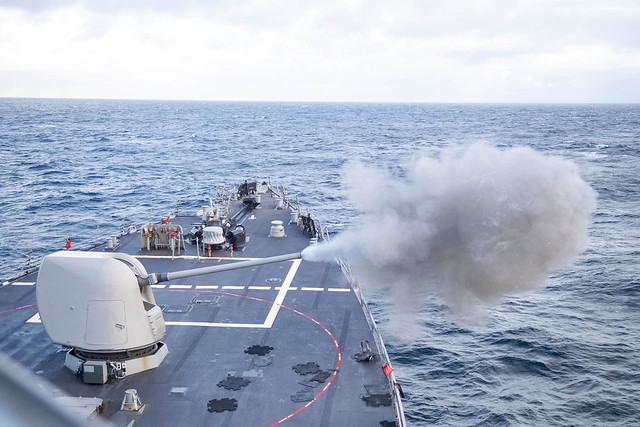 The Arleigh Burke-class guided-missile destroyer USS Ross (DDG 71) conducts a 5-inch live-fire exercise during Exercise Joint Warrior 20-2.