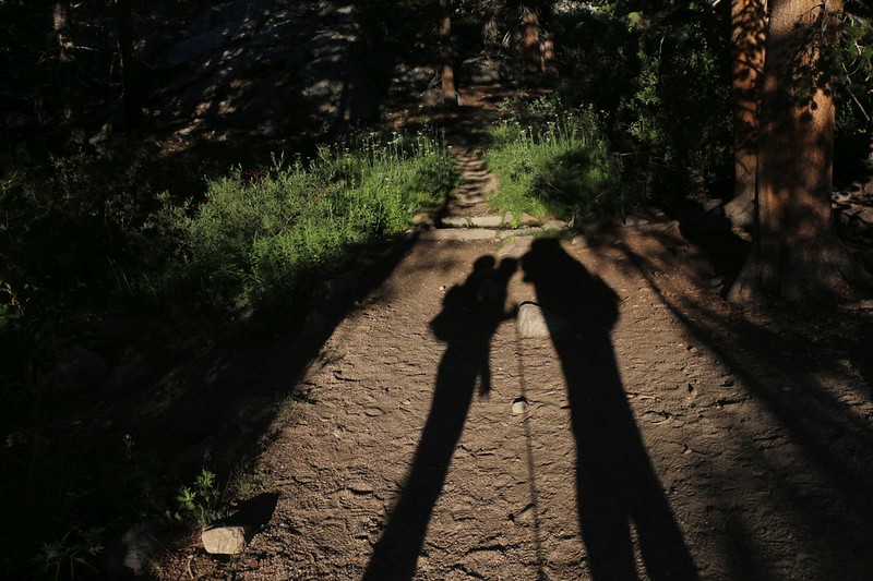 Vicki and I shadow-kissing on the NF Big Pine Creek Trail in the early morning