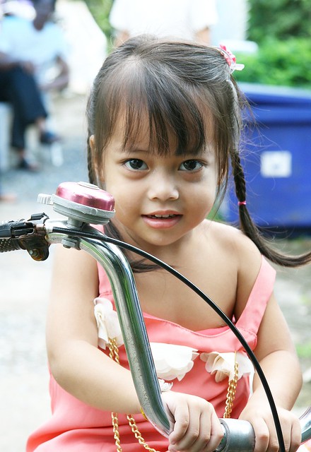 pretty girl on a tricycle