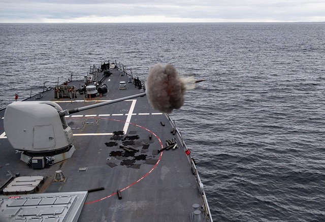 The Arleigh Burke-class guided-missile destroyer USS Ross (DDG 71) conducts a 5-inch live fire exercise during Exercise Joint Warrior 20-2.