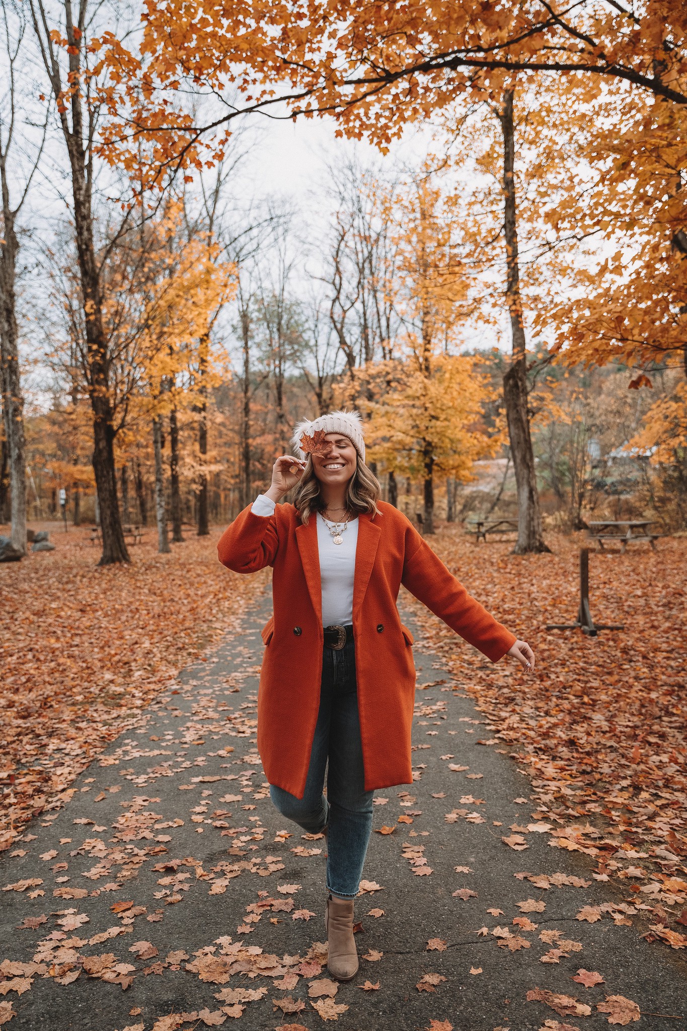 Fall Leaf Photo Prop | How to Pose with Fall Leaves | Fall Foliage Outfit | Orange Coat | What to Wear in Vermont in the Fall | Vermont Packing List for Fall | What to Wear in Vermont in October | What to Wear on a Fall Vacation | Fall Outfits